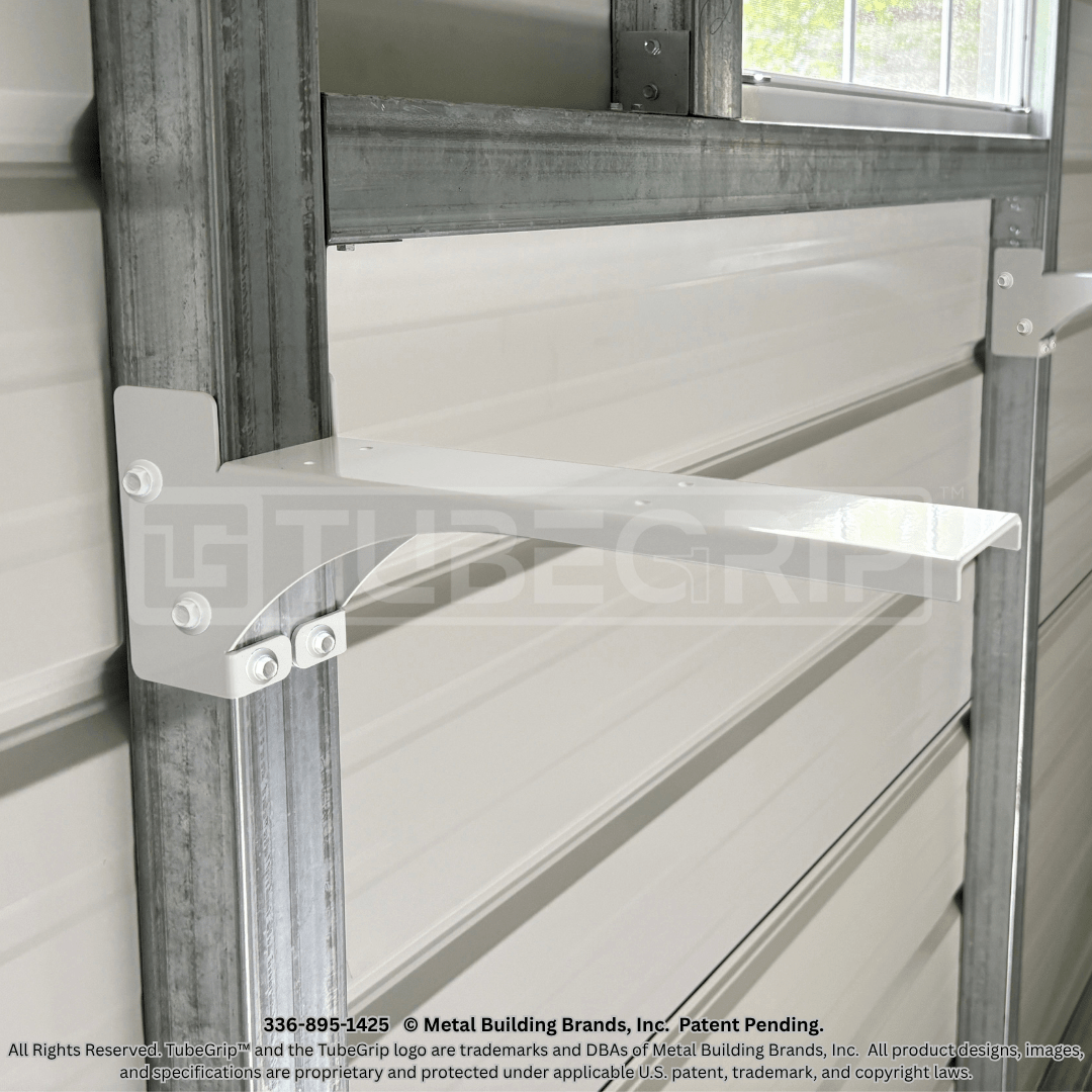 Mounted TubeGrip™ 12-inch 14-gauge steel shelf bracket with screws secured to tubular-steel structure.